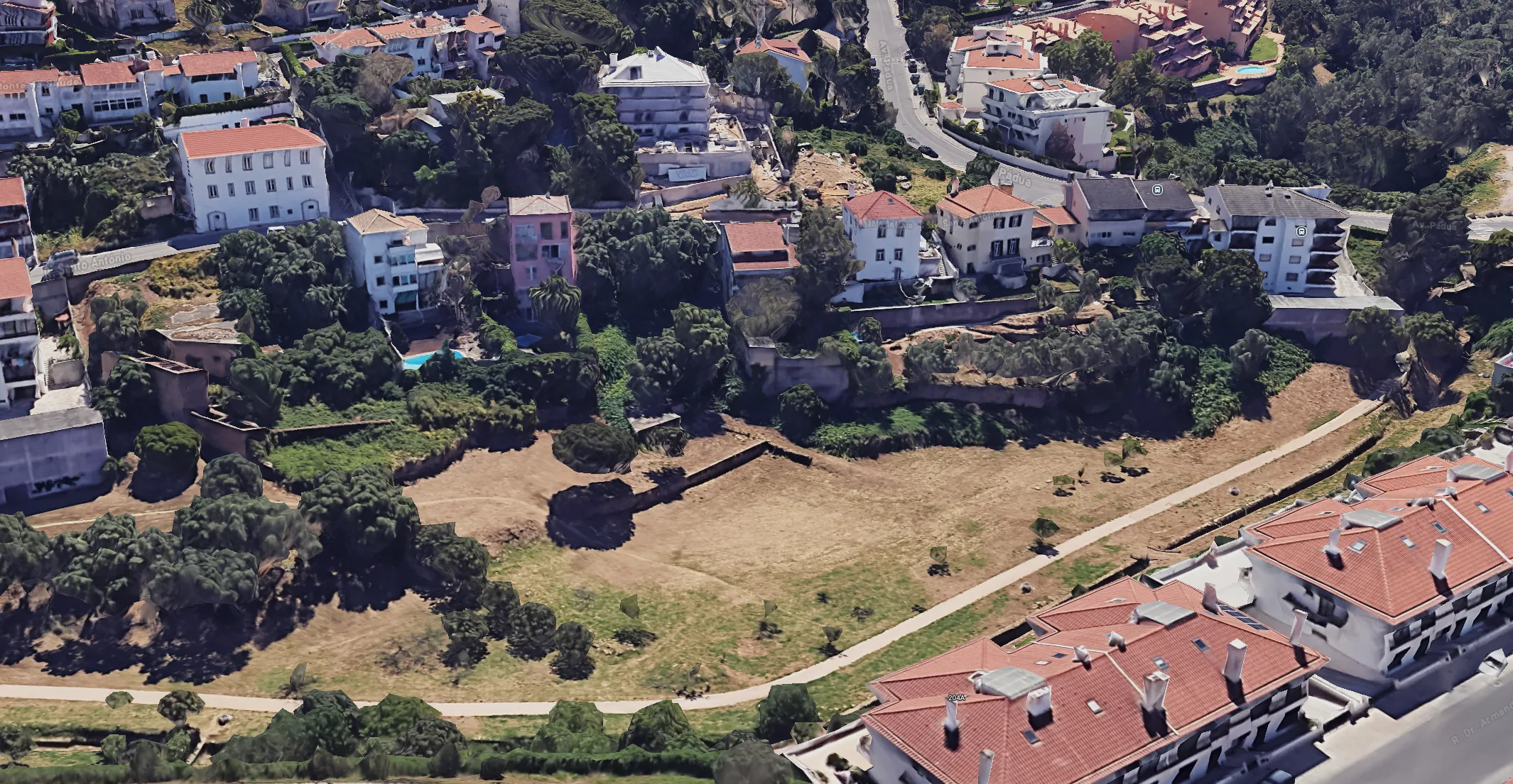 Wide site view across the two houses